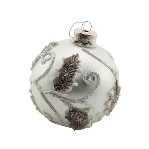 This product is a Christmas ornament ball made of high-quality glass and decorated with a beautiful leaf design.