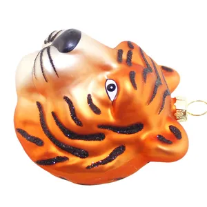 This product features intricate black stripes and glitter, adding depth and dimension to the tiger head design. The glitter adds a touch of sparkle and glamour, enhancing the overall visual appeal of the ornament.