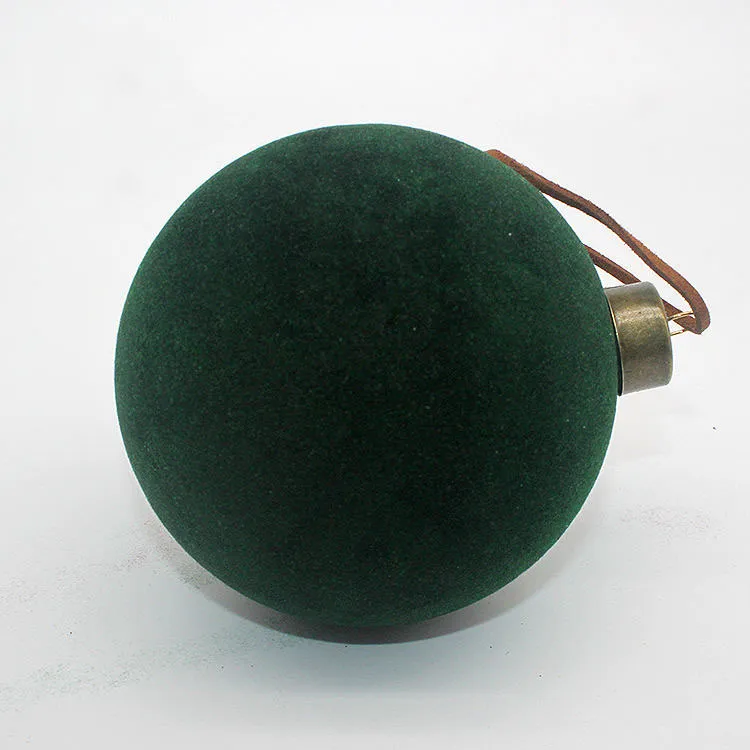 This product is a glass Christmas tree ornament with a plush flocking finish. The soft, velvety texture adds a touch of luxury to any holiday decor. This product is perfect for creating a warm and inviting atmosphere for your Christmas celebrations.