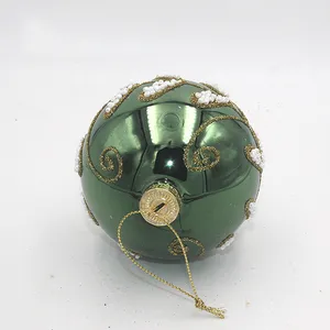 This product is a beautiful 8cm glass ornament for Christmas.  It is green and features white beads and gold details for a festive look.