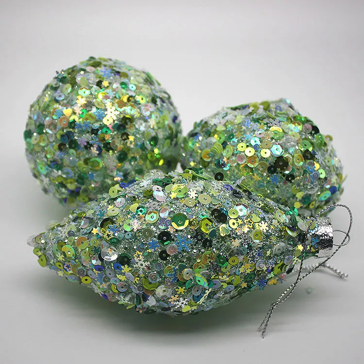 This product is made from glass and decorated with sequins, creating a beautiful and festive look.