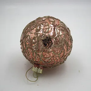 This product is made from hand blown glass with a rose gold finish and a gold glitter design.
