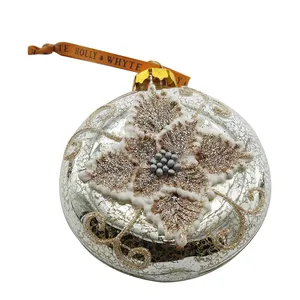 This product is a hand-painted glass Christmas ornament with a flat ball shape for decorating Christmas trees. The ornament is custom-designed and ideal for wholesale.