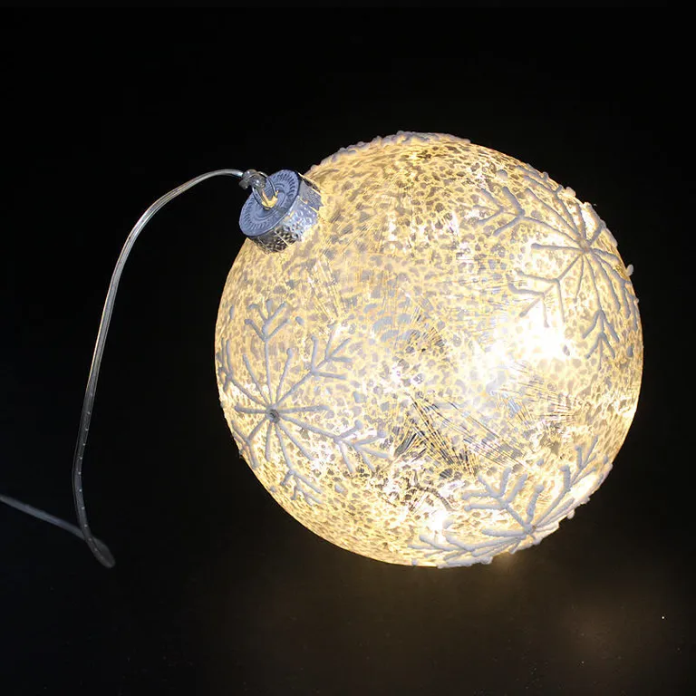 This product is a hand-painted Christmas ornament with LED lights, perfect for adding festive sparkle to holiday decorations. The bauble is made from high-quality glass, features a snowflake design, and is battery operated.