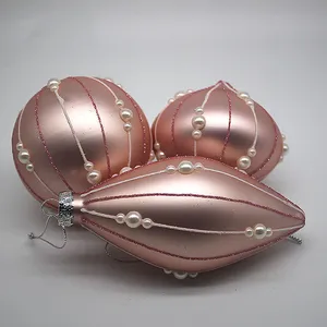This product is made from high-quality glass and features a pink matte finish. It is adorned with pearl decorations, adding a touch of elegance to its design.