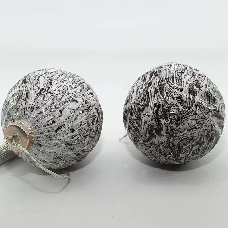 The product is made of glass and has a leopard print design.