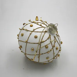 This product is a stylish and elegant Christmas ornament ball. The matte white finish and gold design create a timeless and sophisticated look.