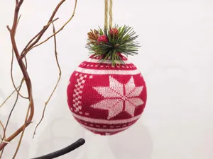 This product is a foam Christmas ornament ball covered in red knitted fabric with a white snowflake pattern. It is a perfect Christmas home decoration.