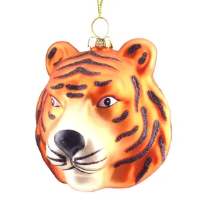 This product is meticulously handcrafted, showcasing intricate details and a high level of artistry. The glass is carefully molded into the shape of a tiger head, and the black stripes and glitter are applied with precision.