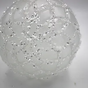 These Christmas ornaments are made of blown glass and then decorated with beads and glitter.