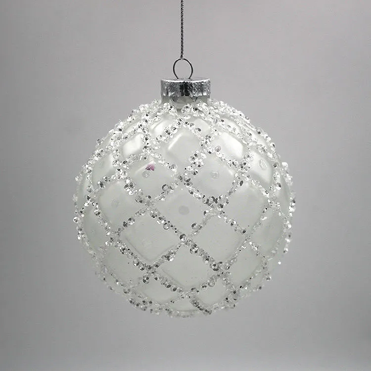 These Christmas ornaments are decorated with a grid pattern of glitter beads.