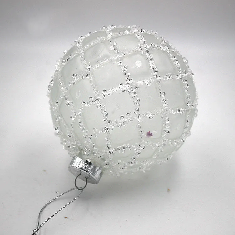 These Christmas ornaments are made of glass with a frosted finish and are decorated with glitter beads.